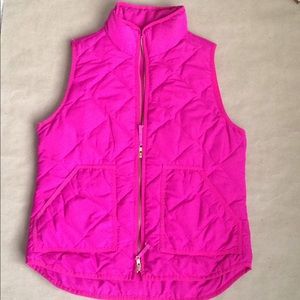 A pink J. Crew Factory puffer vest
